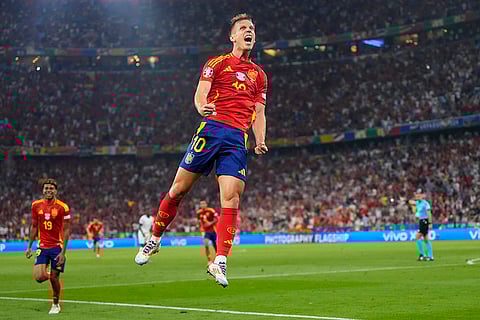 Dani Olmo celebrates after scoring Spain's second goal